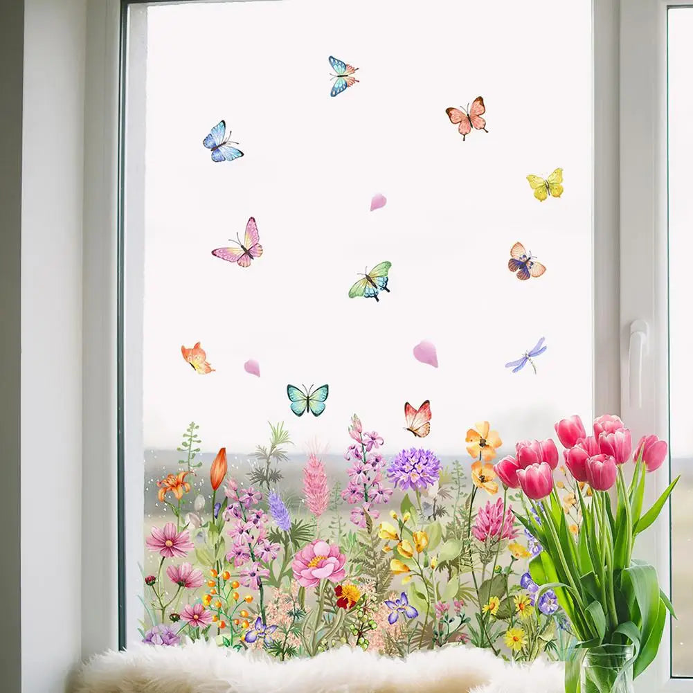 Colorful butterfly and flower static cling window decal displayed on a window with soft lighting.