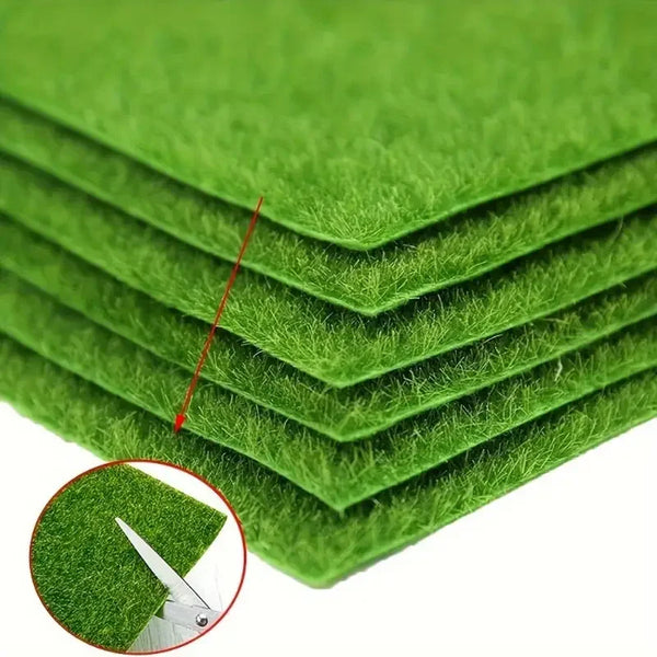 Stack of bright green artificial grass mats showing the texture and layering.
