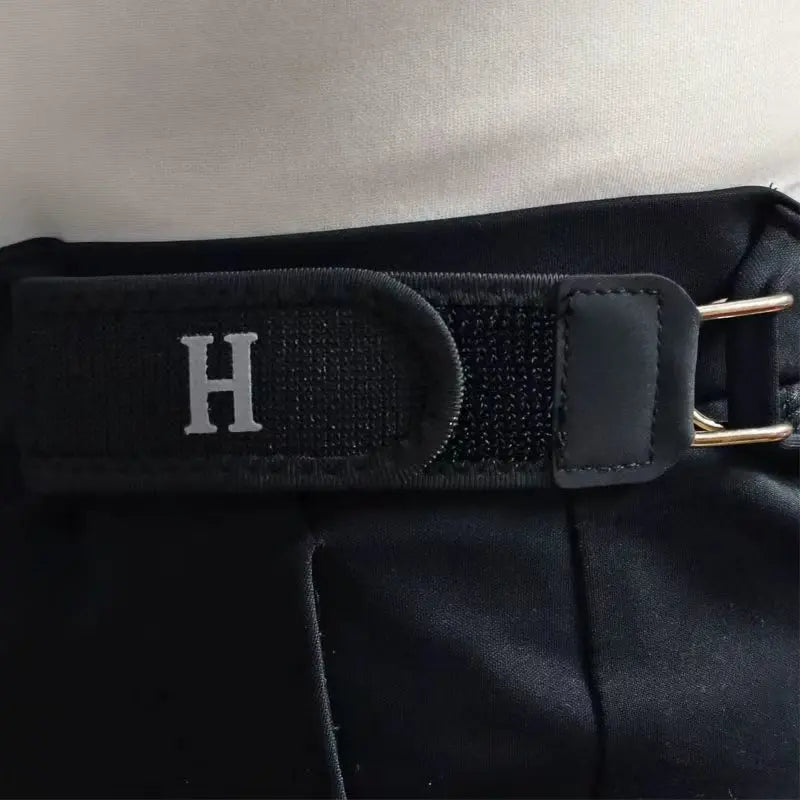Black lazy belt with a silver H metal hook and elastic waistband