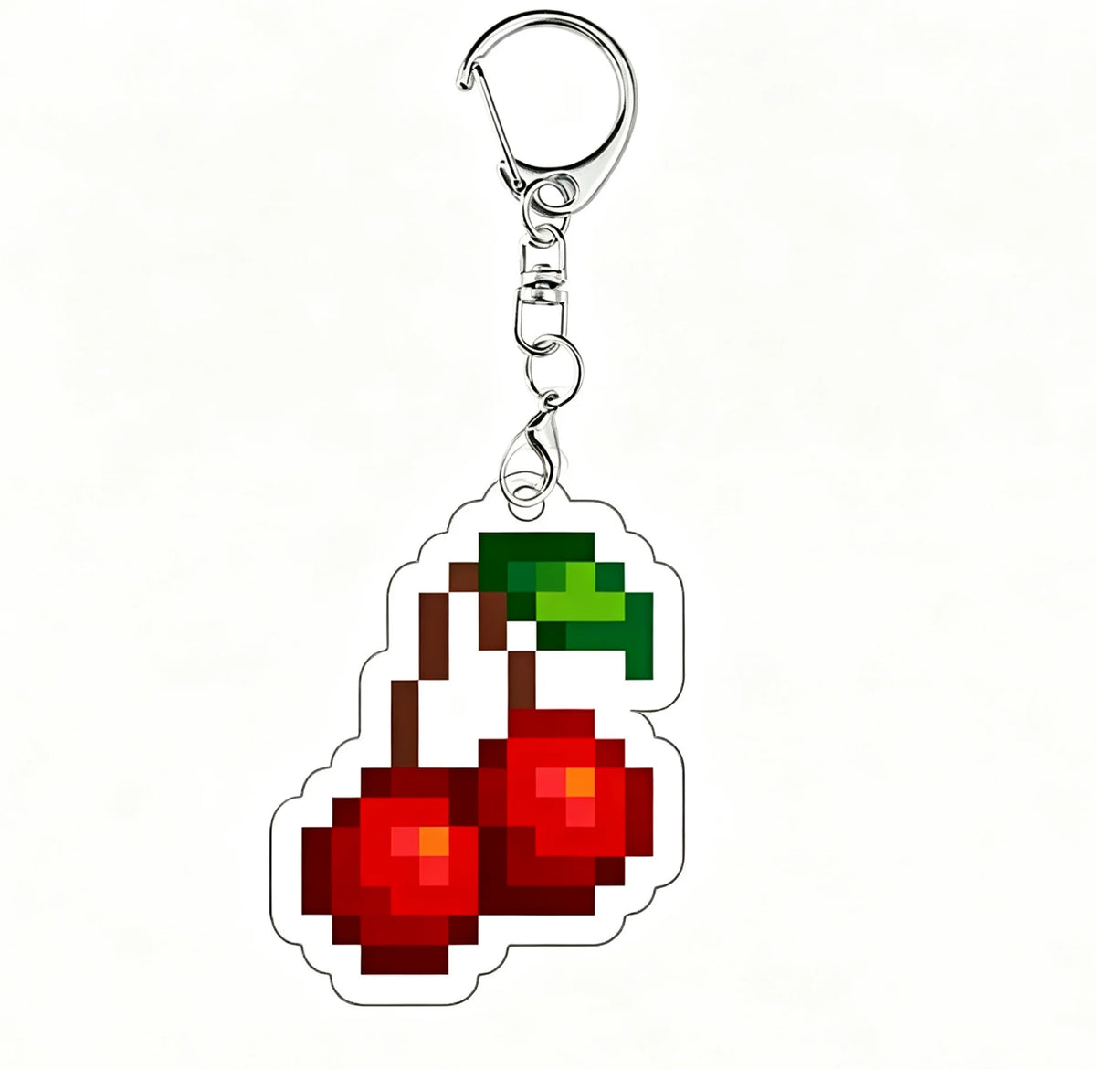 A shiny silver acrylic keychain charm shaped like a red and yellow apple.