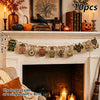 A decorative vintage wooden Halloween flag set featuring pumpkins, ghosts, and moons displayed above a fireplace mantel.