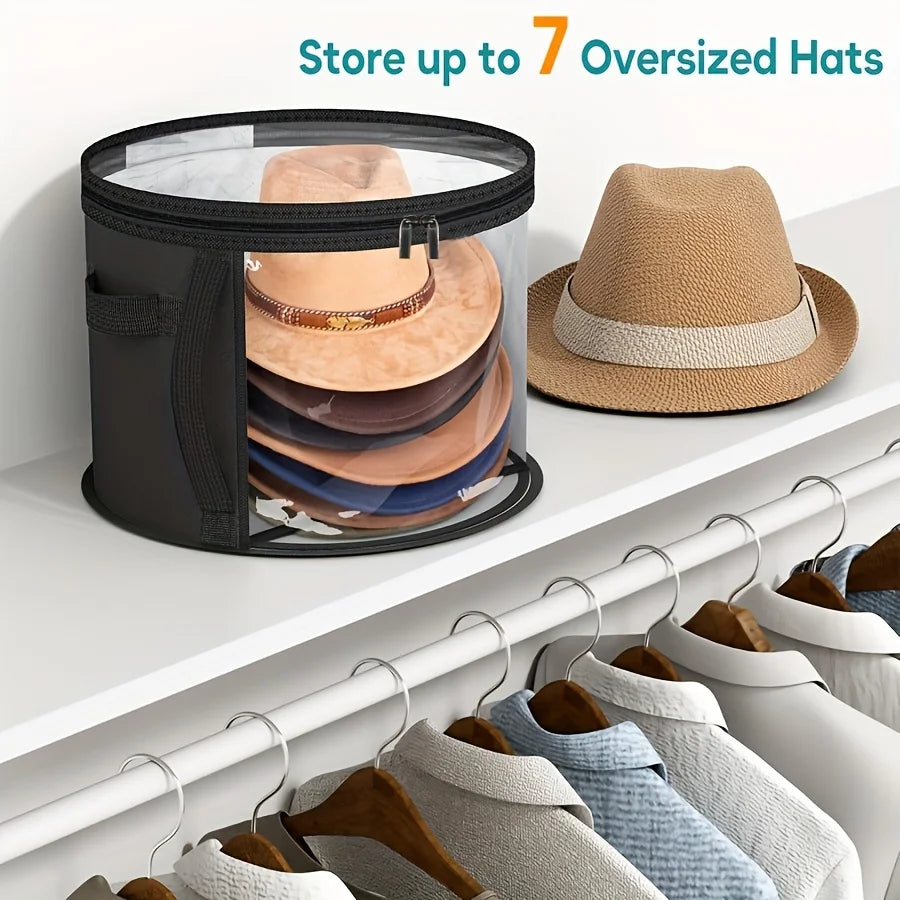 A black storage box with a clear window holds seven oversized hats on a shelf.
