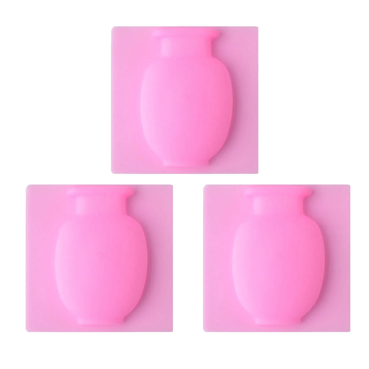 Three pink flexible self-adhesive wall flower vases shown in different orientations.