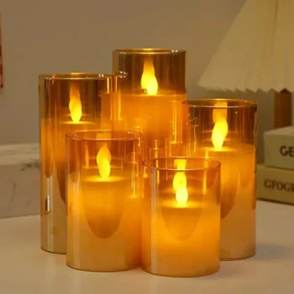 A set of amber glass LED flameless candles with flickering flame effects on a white surface.