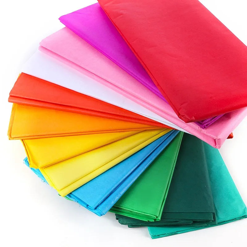 A stack of brightly colored soft tissue paper sheets in various shades including pink, red, orange, yellow, blue, and green.