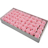 A rectangular box filled with pink artificial rose heads for wedding and party decor.