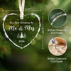 A clear heart-shaped crystal ornament with a silver ribbon, engraved with Our First Christmas As Mr & Mrs 2026.