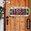 A vintage metal plaque with the year 1968 and stars is mounted on a wooden door.