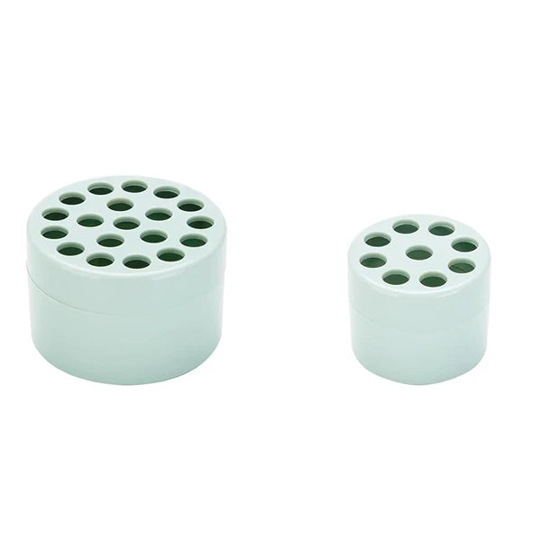 A pair of light mint green spiral stem holders for DIY floral arrangements.