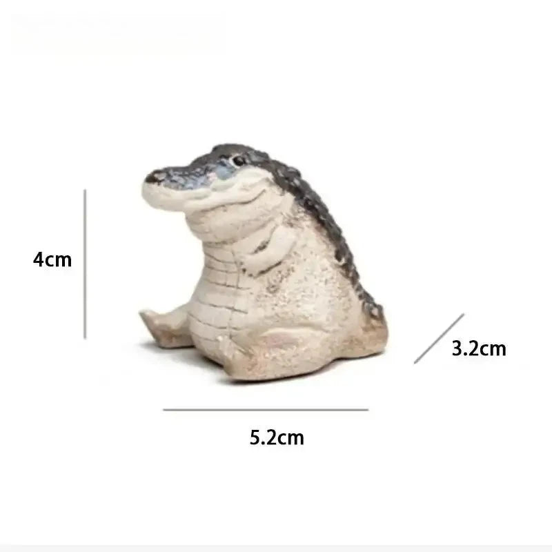 Handmade resin crocodile tea pet ornament with dimensions 4cm high and 5.2cm long.
