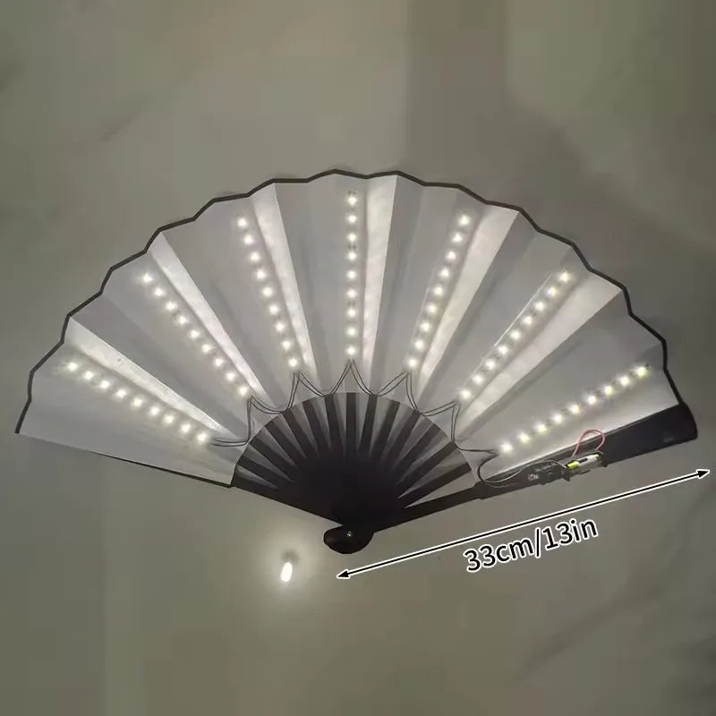 A white folding LED fan with numerous lights is displayed, showing its full spread and size.