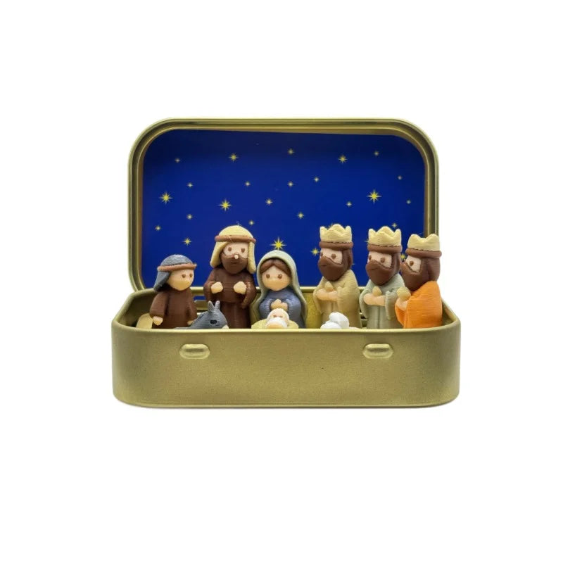 Miniature Nativity Scene set featuring Mary, Jesus, shepherd, and animal figurines displayed in an open gold-colored box.