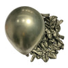 A single silver chrome metallic latex balloon next to a pile of crumpled silver foil balloons for party decor.