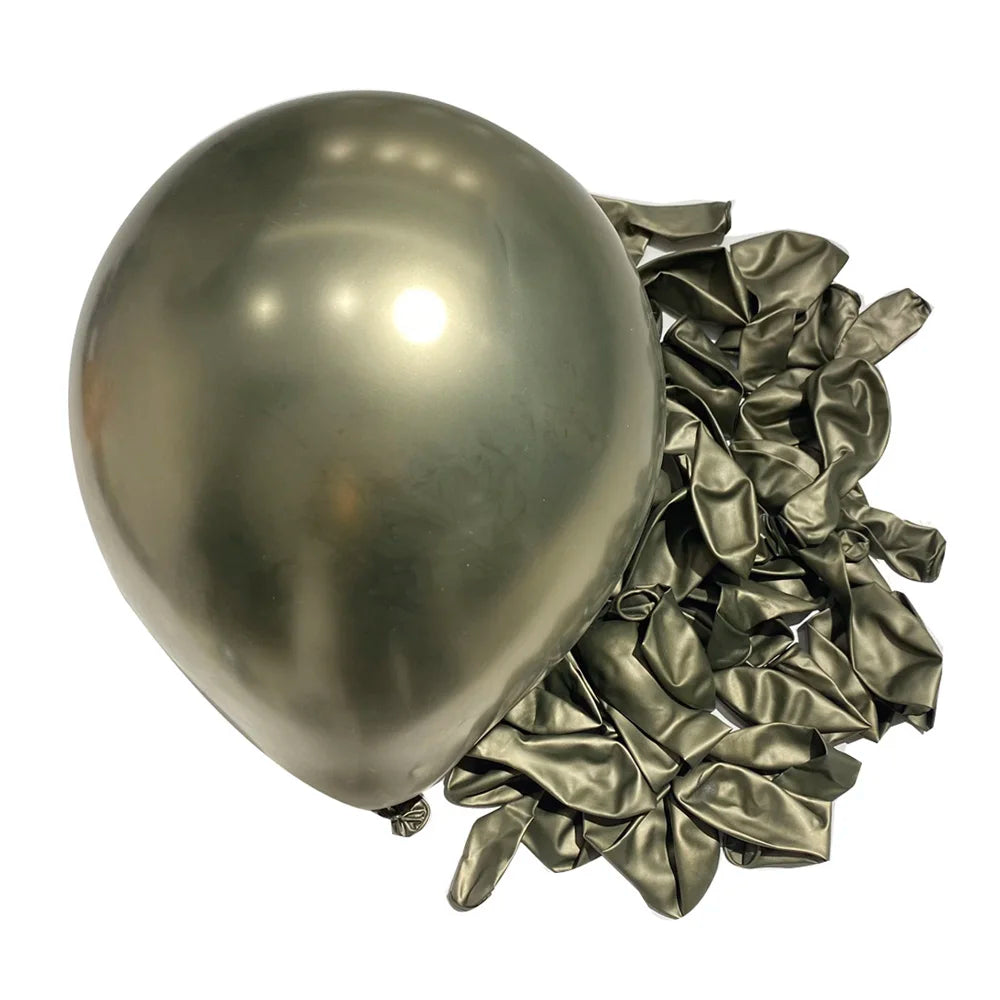 A single silver chrome metallic latex balloon next to a pile of crumpled silver foil balloons for party decor.