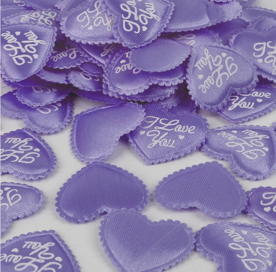 Purple heart-shaped sponge confetti for weddings and celebrations