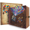 A handmade photo scrapbook album with a cover featuring colorful balloons and an adventure theme.