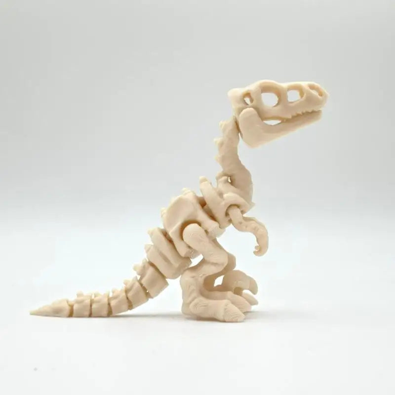 A light beige 3D printed dinosaur skeleton model displayed against a white background.
