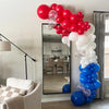 A balloon arch display featuring blue, pink, and white latex balloons for a party backdrop.