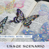 A close-up of a butterfly series sticker pack featuring iridescent and holographic designs on a page of a notebook.