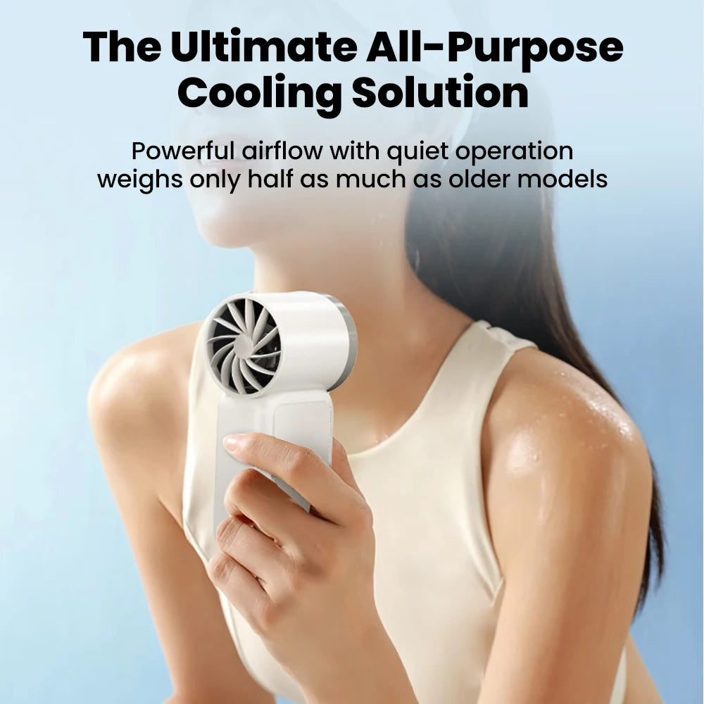A person is holding a white portable rechargeable mini handheld fan near their face.