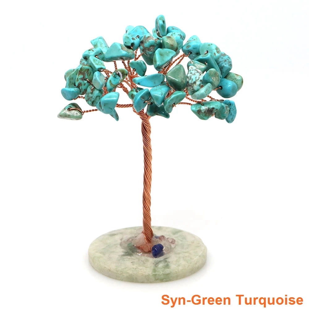 A natural crystal money tree decor featuring turquoise-blue leaves mounted on a copper wire stem and base.