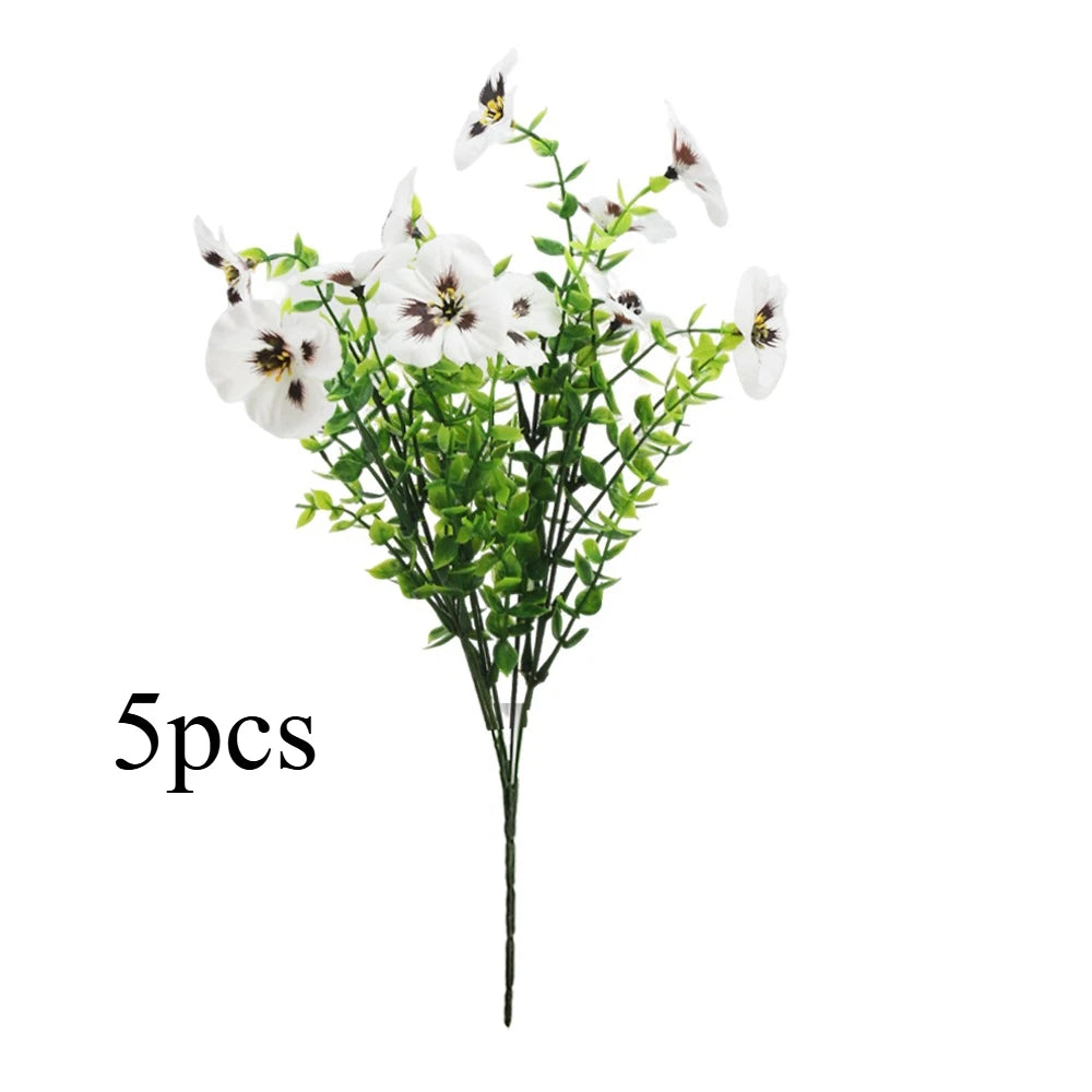 A bouquet of five artificial white pansy flowers on a green stem.