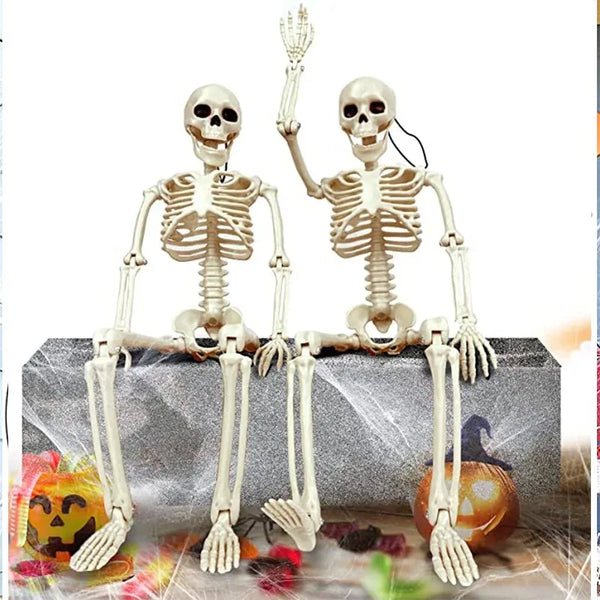 A pair of poseable human skeleton decorations with movable bones displayed on a gray box.