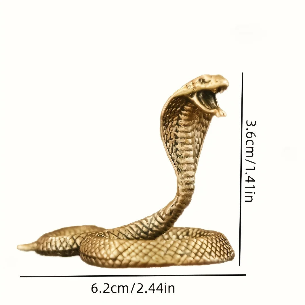 A brass snake sculpture with intricate detailing shown in profile against a white background.