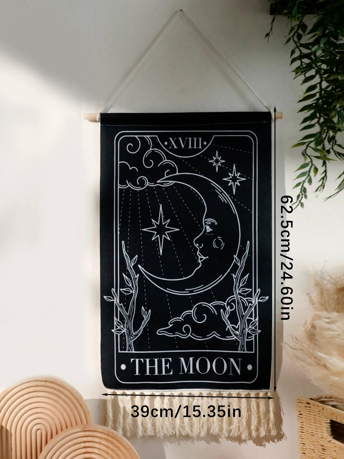 Black sun and moon boho wall tapestry featuring a line drawing of the moon and stars