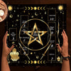 Hands holding a black altar cloth featuring the Celtic Cross symbol and astrological symbols for tarot divination
