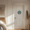 A white wooden door features a circular sign depicting lavender and candles.
