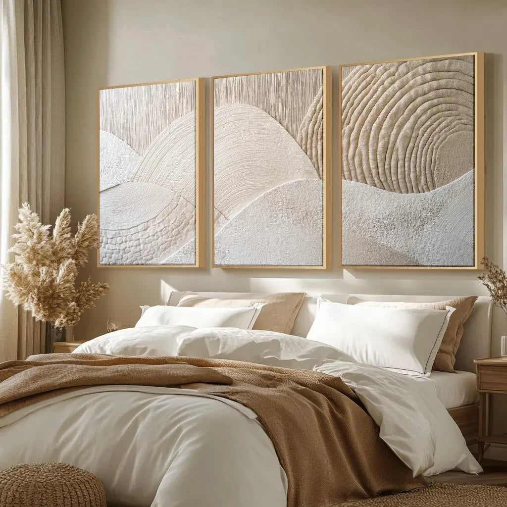 A set of three beige textured abstract canvas wall art prints featuring minimalist mountain lines and swirling patterns.