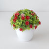 Arrangement sphérique de décoration de bonsaïs artificiels avec feuillage vert et bouquets de fleurs rouges et roses.