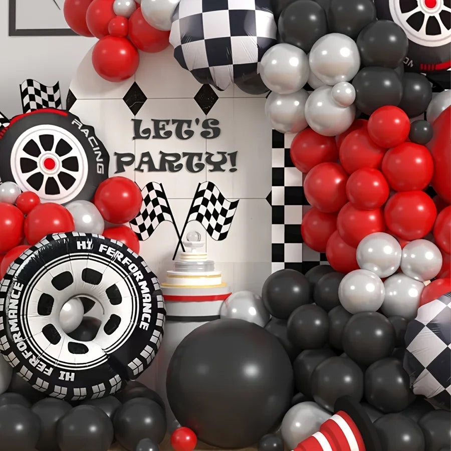 A balloon garland arch featuring checker tire balloons in red, black, and white colors.
