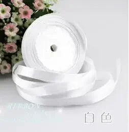 Roll of white silk satin ribbon with a central hole