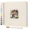 A beige linen cover scrapbook album with a photo insert and a gold-colored spiral binding.