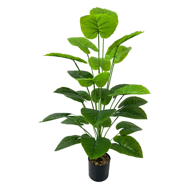 A lush green artificial tree with large, vibrant leaves used for indoor and outdoor decor.