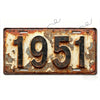 A vintage style aluminum license plate with the year 1951 embossed on it, showing signs of rust and weathering.