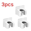 Three white self-adhesive wall holders for storing mops, brooms, and long-handled tools.
