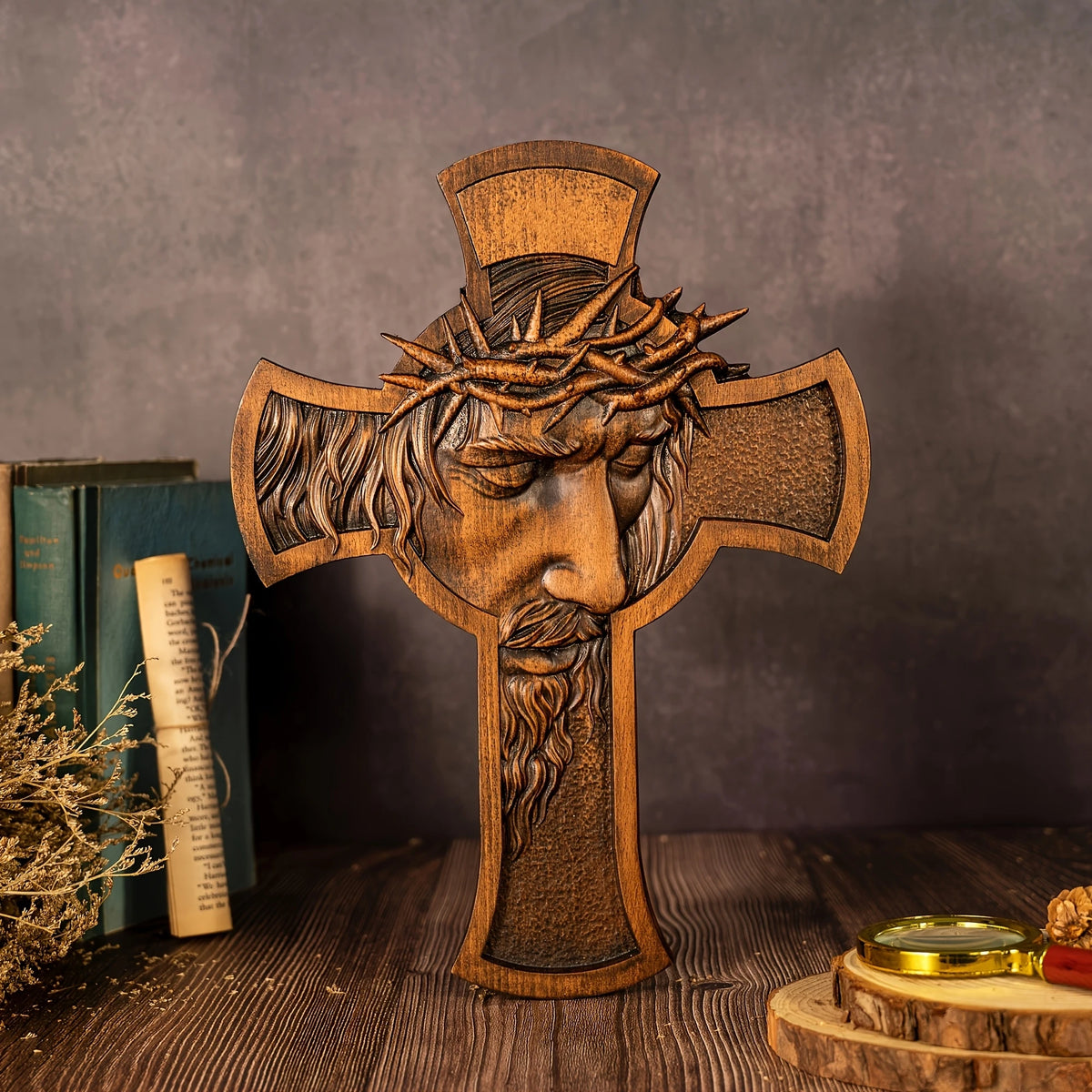 A carved wooden cross featuring a crown of thorns, used as wall decor.
