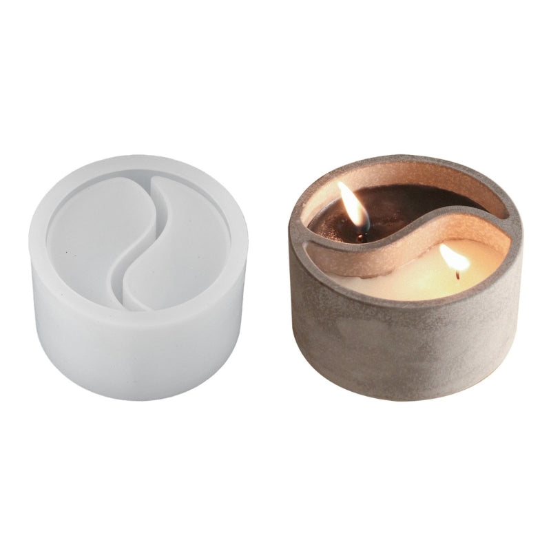 A pair of Yin Yang Tai Chi silicone molds for DIY candlestick holders, showing a white and a bronze-colored design.