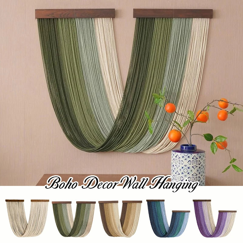 A vertical tapestry featuring vertical stripes of green and beige fabric hanging on a wall.