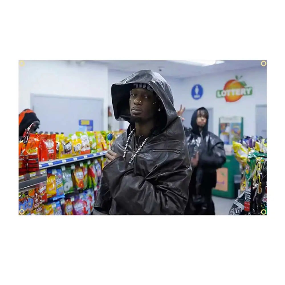 A person wearing a black hooded jacket is standing in a store aisle with colorful products visible.