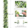 Artificial eucalyptus vine garland featuring delicate white flowers and green leaves.