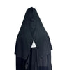 A black latex mask resembling a nun is shown in a draped, hooded style.