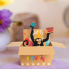 A humorous 3D pop-up birthday card featuring a black silhouette of a monkey holding a cake and heart balloons.