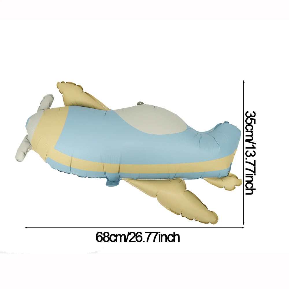 A light blue and beige foil balloon shaped like a bear with a heart design.