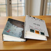 A white and gray cartoon cover photo album with a cat design and a message that reads you are lovely