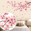 Pink peach blossom branch wall decals featuring pink flowers and falling petals against a light background.