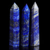 Three tall, polished blue lapis lazuli crystals standing upright against a black background.